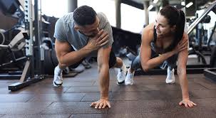 Toning Bingo Wings: Your Ultimate Guide to Sculpting Sleek Arms at the Gym 3 Fitness trainer demonstrating arm toning exercises West Mersea